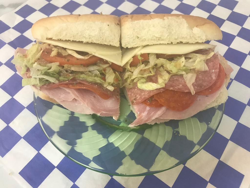 Italian Sub · Fresh ham, salami, and pepperoni topped with provolone, green peppers, sliced tomatoes, lettuce, and oil and vinegar.