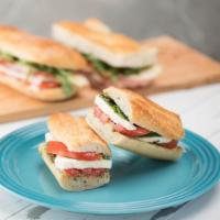 Caprese Sandwich · Roasted tomatoes, mozzarella, and basil on baguette.