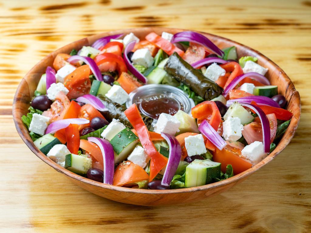 27- GREEK SALAD · Roman lettuce, grape leaves, feta cheese, cucumber, red onion, red pepper, plum tomato, Greek olives, oregano.