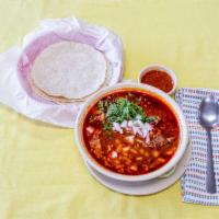Birria de Res · Served with rice, beans and choice of tortilla.