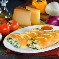 Spinach Roll · Rolled homemade Pizza Crust, Chopped Spinach, Garlic, Ricotta, Romano & Mozzarella Cheese
