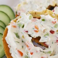 Bagel with Veggie Cream Cheese · Boiled and baked round bread roll.