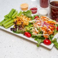 Buffalo Chicken Salad · Romaine, Buffalo chicken, pepper jack cheese, celery, tortilla strips and blue cheese dressi...