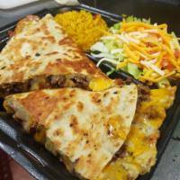 Combo Quesadilla · Chicken and steak with peppers and onions, cheddar cheese, Jack cheese, sour cream and salsa.