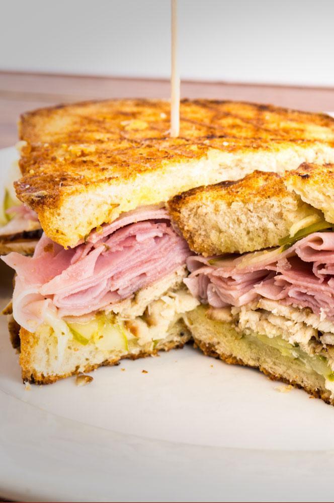 P7. The Combo Panini · Pastrami, corned beef, provolone cheese, lettuce, tomatoes, mustard and hours dressing.