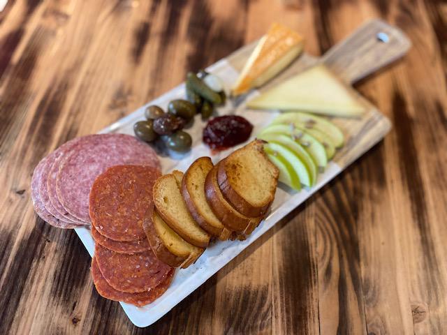 Charcuterie Board · two cheese and meats  with crostini and seasonal accompaniments.