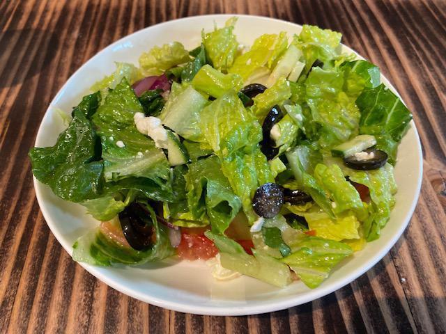 Greek Salad  · Chopped romaine, cucumber, tomato, black olives, red onion, fetacheese with balsamic vinaigrette.