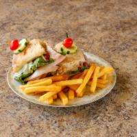 Rustic Turkey Sandwich & fries  · Roasted peppers, lettuce, tomato, provolone and honey mustard.