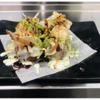 Takoyaki Octopus Ball · 4 Jumbo octopus ball topped with sweet wasabi mayo, eel sauce, smoked tuna flakes and sprink...