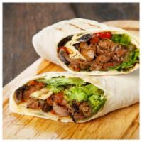 Marinated Grilled Chicken Wrap · Marinated grilled chicken wraps with fresh lettuce, tomatoes, onion, chipotle peppers, garli...