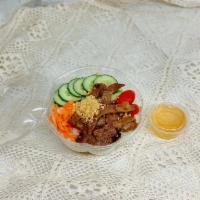 Marinated Grilled Pork Bowl · Item contains: rice noodle, lettuce, tomatoe, cucumber, marinated carrot and white radish, g...