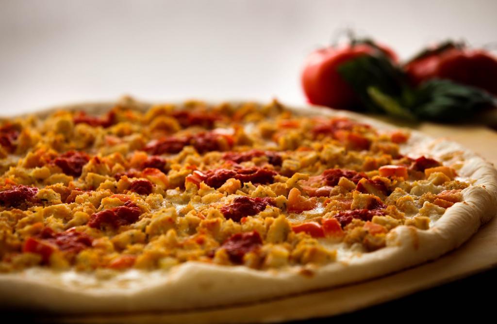 Chicken Parm Pizza · Chicken cutlet, diced tomato, mozzarella, and marinara sauce.