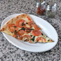 Tomato Garlic Pizza · Fresh garlic, sliced plum tomato, mozzarella cheese, and olive oil.