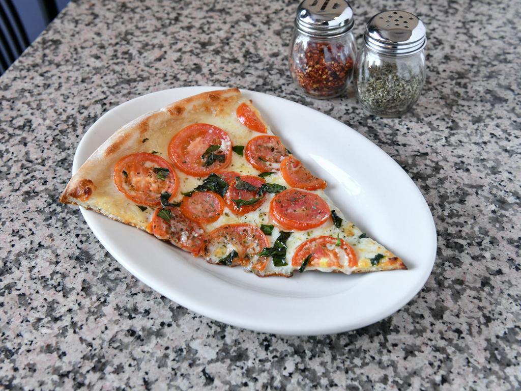 Tomato Garlic Pizza · Fresh garlic, sliced plum tomato, mozzarella cheese, and olive oil.
