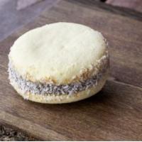 Alfajor · Argentinian sandwich pastry made from maizena flour, dulce de leche and shredded coconut