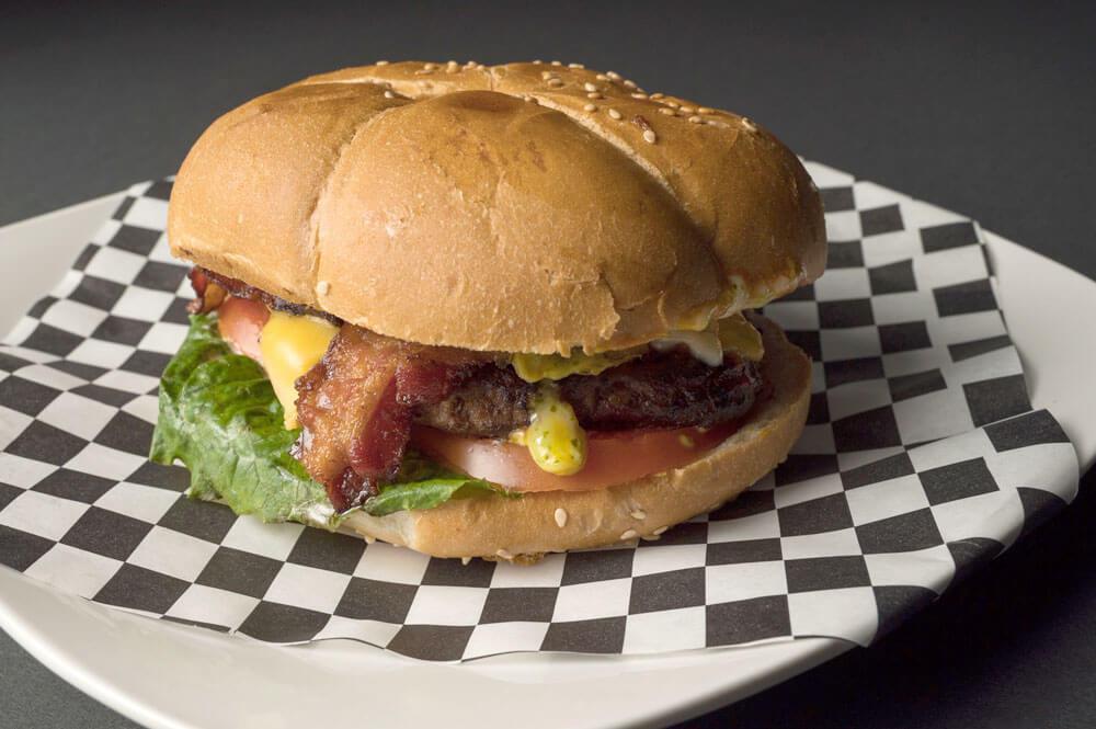 Burger · It has a beef patty, cheese, bacon, lettuce, tomato, and optional ingredients like pickles, jalapeno, or onions.