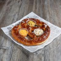 Giant Soft Pretzel · Served with bacon ranch dip, beer cheese dip and gourmet mustard.