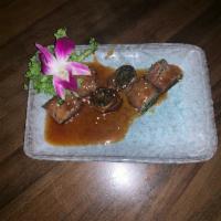 Beef Negimaki App · Beef wrapped with scallion broiled with teriyaki sauce. 