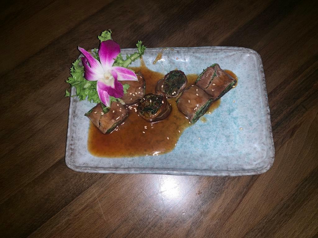 Beef Negimaki App · Beef wrapped with scallion broiled with teriyaki sauce. 