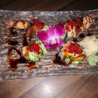 River Roll · Spicy shrimp tempura, topped with avocado, eel and tobiko. 