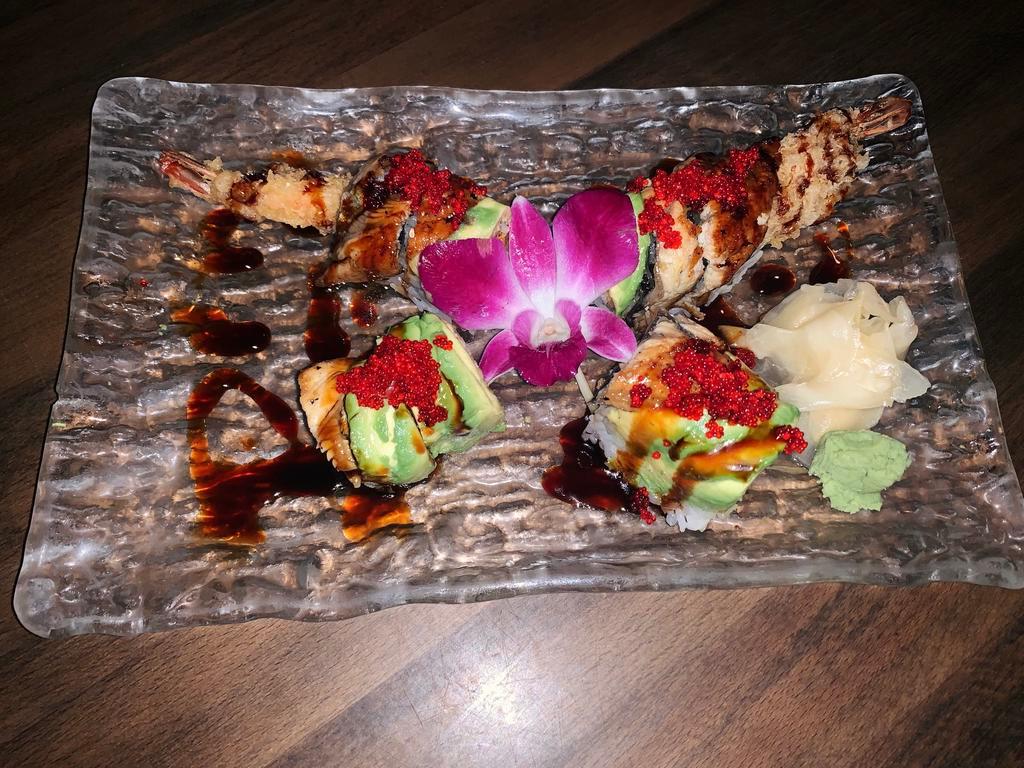 River Roll · Spicy shrimp tempura, topped with avocado, eel and tobiko. 
