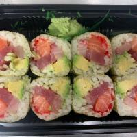 Mermaid Roll · Tuna, yellowtail, salmon, tobiko, avocado, cucumber and scallion wrapped with marble seaweed. 