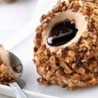 Hazelnut Truffle · Hazelnuts semifreddo ice cream with a liquid chocolate core, coated with praline hazelnuts a...