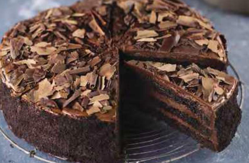 Old Fashioned Chocolate Cake  · Alternating layers of rich fudgy cake and smooth chocolate icing, decorated with chocolate shavings