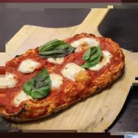 Roman Classic Margherita Pizza · Signature marinara, shredded mozzarella, and oregano.