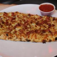 Bacon Cheesy Bread · Freshly baked bread, covered with melted shredded mozzarella cheese, garlic and topped with ...