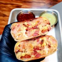 Bacon Burrito · Bacon, eggs, potato, onion, and cheddar cheese. 