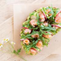 Avocado Saumon Fume · Avocado toast topped with smoked salmon, capers, shaved radishes and chives.