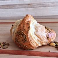 Pistachio Croissant  · A flaky French pastry.