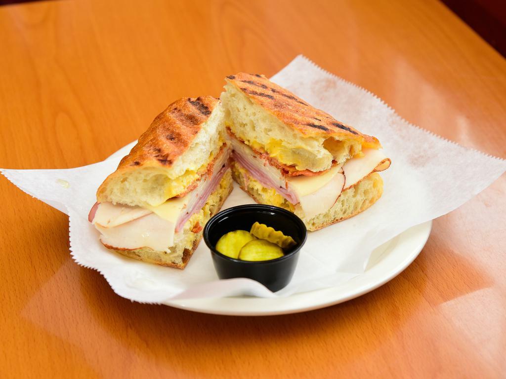 Smokey Black Forest · Turkey, ham, crispy bacon and provolone cheese, topped with Honey Mustard spread.