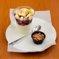 Yogurt Parfait · Vanilla yogurt served with banana and granola, infused with your choice of strawberry, wildb...
