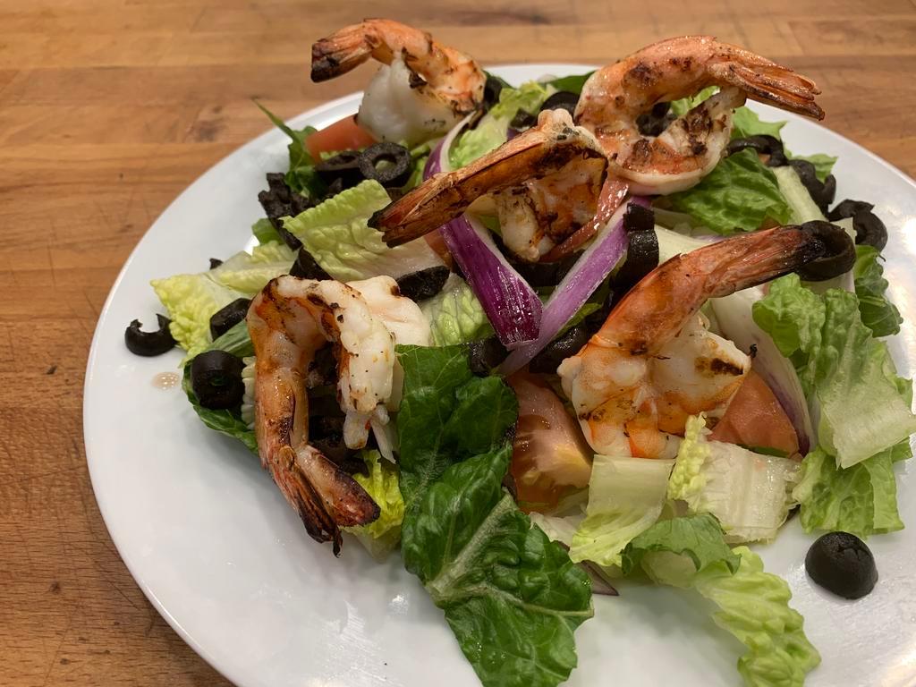 Shrimp Salad · iceberg lettuce , tomatoes,cucumbers,black olives & onions topped with grilled seasoned shrimp