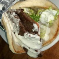 Gyro Sandwich · Served with white sauce, lettuce, tomato and onions.