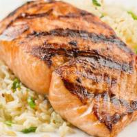 Salmon · Grilled salmon marinated with homemade garlic sauce Served with rice and sauté broccoli and ...