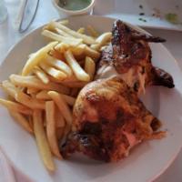 1/2 Chicken · Rotisserie chicken on charcoal grill , Comes with rice or skin-on fries.