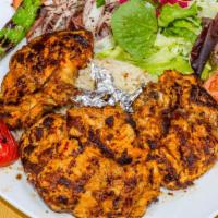 Chicken chops · Marinated boneless chicken thighs grilled to your taste, served with rice, salad & side of t...