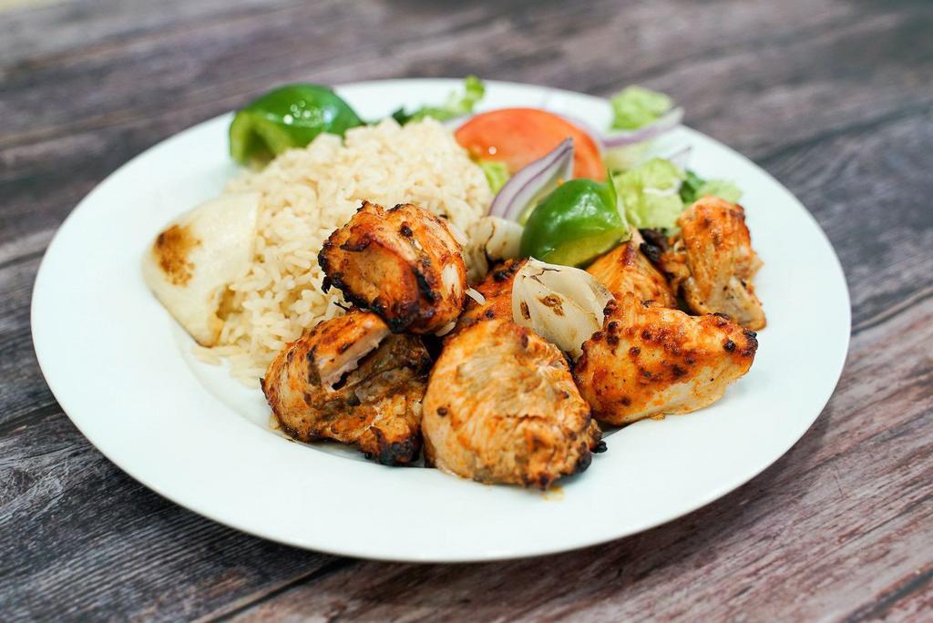 Shish kebab chicken  · Marinated cubes of chicken breast,
Served with rice , salad & side of tzatziki sauce.