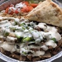 Chicken & lamb over rice with pita bread. · Grilled chicken mix with lamb with grilled onions and peppers topped with white sauce Served...