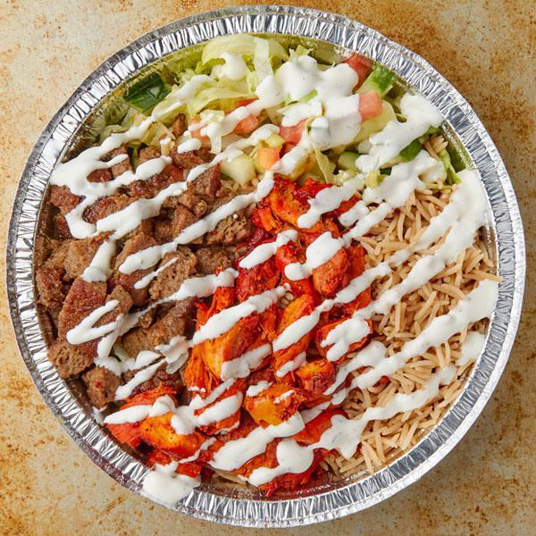 Mixed Chicken and Lamb Over Rice · Comes with salad (lettuce, cucumber and tomato) and choice of sauces.