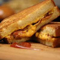 The Classic Grilled Cheese Sandwich · Homemade bread and American cheese.