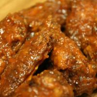 Honey Smoked BBQ Wings · Medium spice. Hand tossed in rich BBQ sauce with smoky sweet flavor. Served with celery and ...