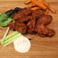 Mexican Chipotle Wings · Hot and spicy. Hand tossed in a blend of savory Mexican herbs and spices and fire-roasted ch...