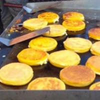 16. Arepas con Queso · Corn cake with cheese.