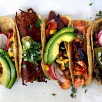 1. Taco · Three tacos with double soft corn tortilla with your choice of meat or vegetables topped wit...