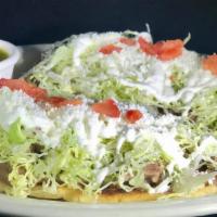 Guaraches · Served with fried beans, lettuce, tomatoes, sour cream, Mexican cheese. Choose 1 steak, chor...