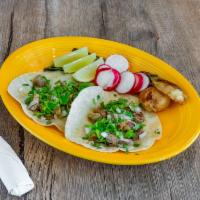 Tacos · Served with onions and cilantro.